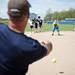 Lincoln Head Coach Wes Strickland throws balls for players to field during practice on Tuesday, May 7. Daniel Brenner I AnnArbor.com